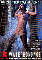 Ariel X in Waterbondage Zip Tied To The Fence